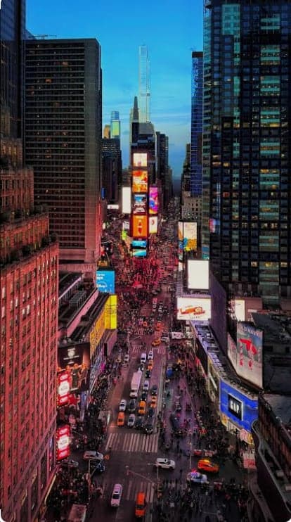 The city at dusk, lit up and always moving